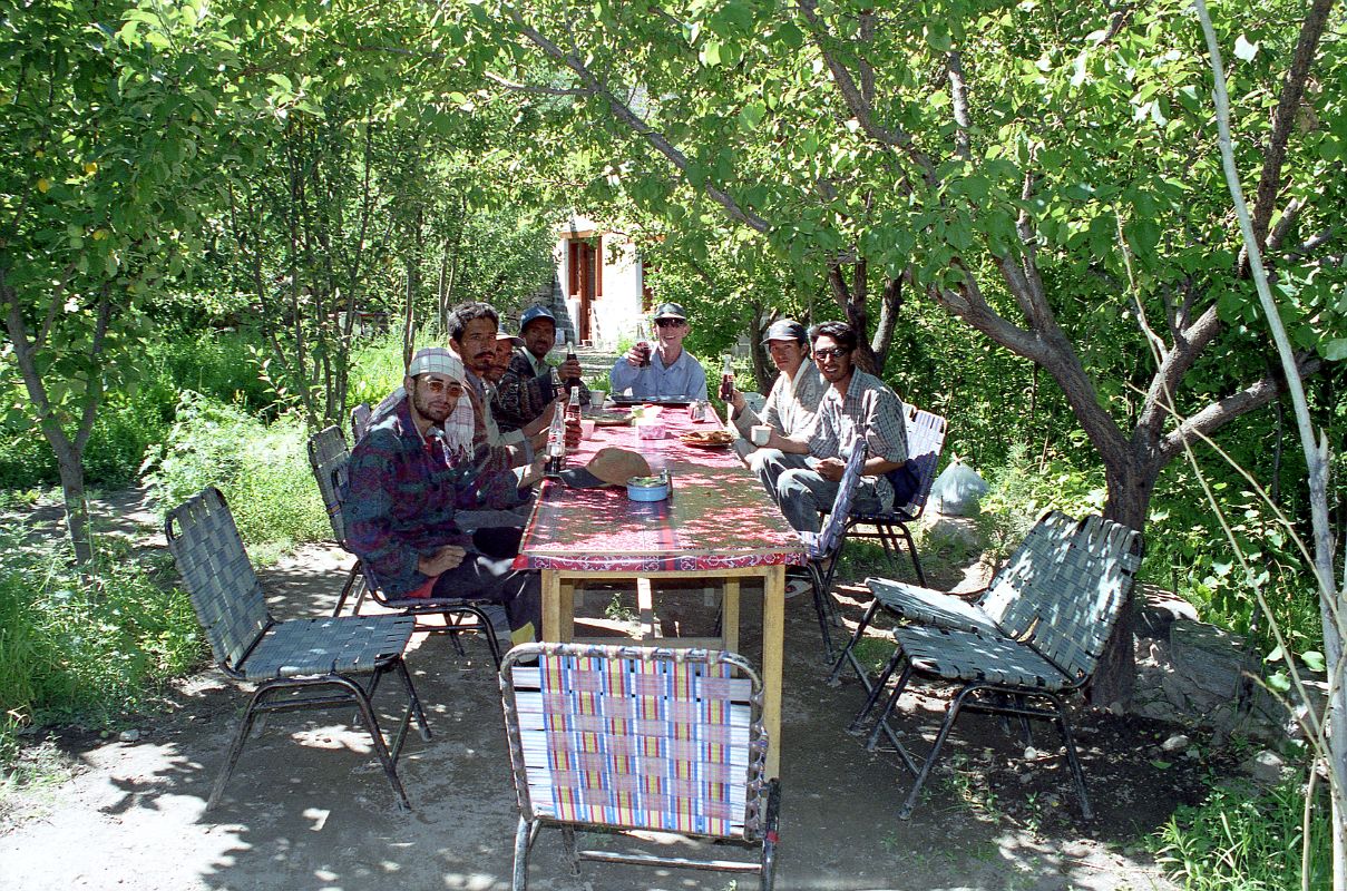 26 Jerome Ryan And Crew Celebrating A Successful Trek On The Way Back To Skardu We stopped for a coke in a green oasis on the drive from Thongol to Skardu to celebrate our successful trek. From left to right: cook Ali, porter Hayder Khan, sirdar Ali Naqi, porter  Muhammad Khan, Jerome Ryan, porter Muhammad Siddiq, and guide Iqbal.
